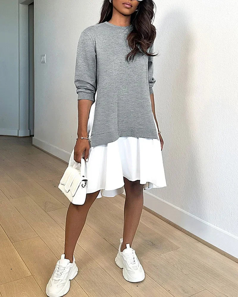 Model wearing EtherealBe fashionable patchwork midi dress with gray sweatshirt top and white flared skirt