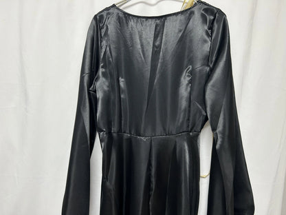 Back view of a sleek black vampire bride cosplay costume with long sleeves and satin finish