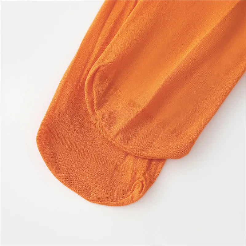 EtherealBe Velma costume for women featuring orange knee-high socks for a complete look