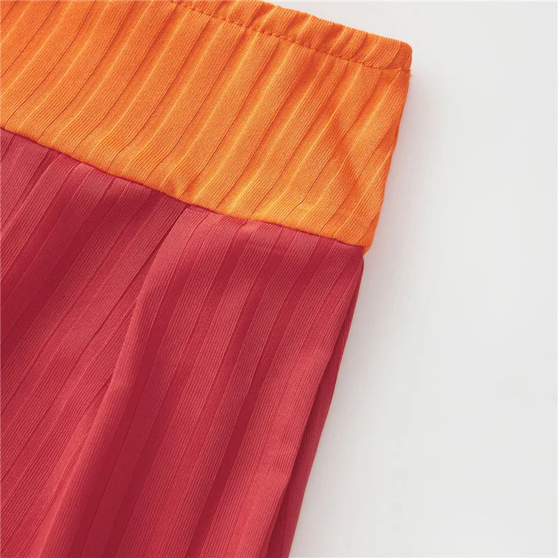 EtherealBe Velma costume for women featuring a pleated red skirt with an orange waistband