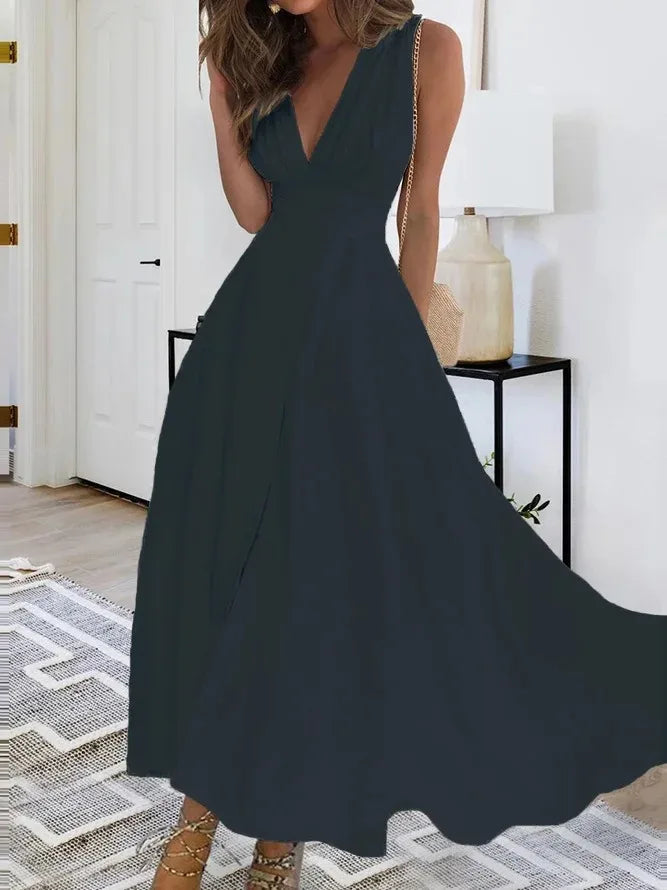 EtherealBe chic sleeveless summer dress in navy blue with a flowing design for warm weather occasions