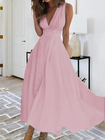 Chic sleeveless summer dress in pink with a flattering V-neckline and flowy design for warm weather