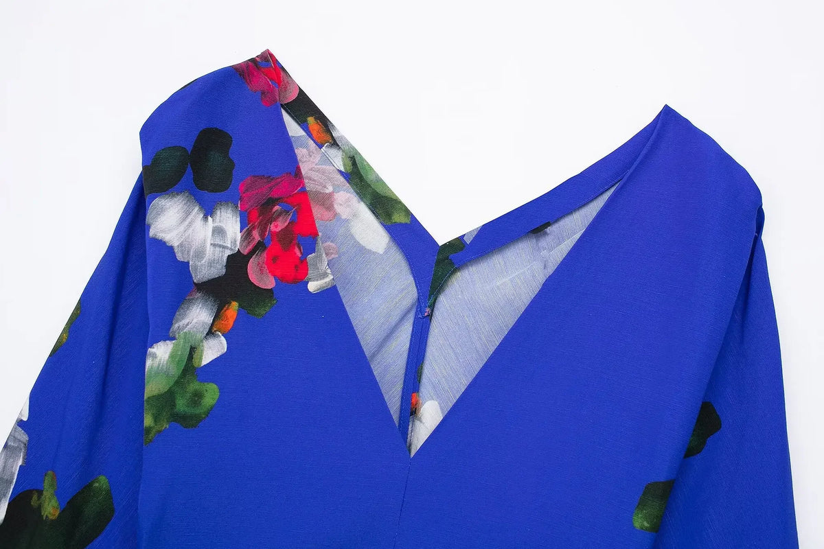 Elegant floral evening dresses for women featuring a vibrant blue fabric and colorful floral design
