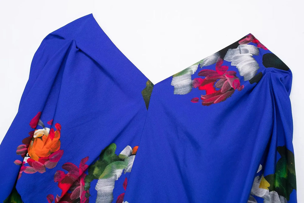 Elegant floral evening dresses for women featuring a vibrant blue fabric with colorful floral prints