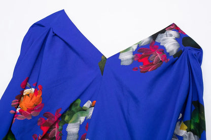 Elegant floral evening dresses for women featuring a vibrant blue fabric with colorful floral prints
