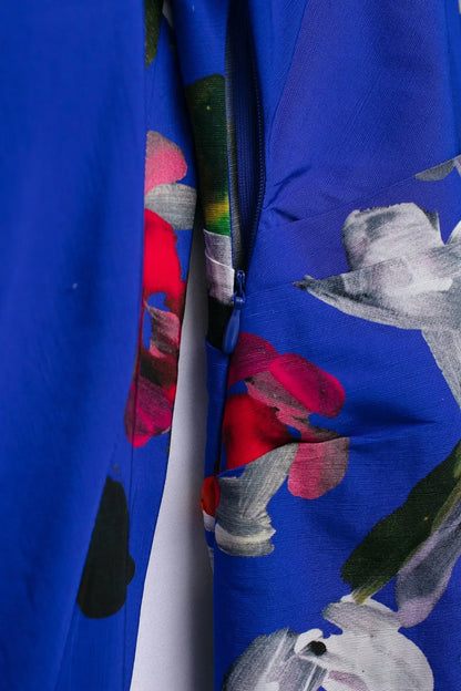 Close-up of elegant floral evening dresses for women featuring vibrant colors and intricate floral patterns