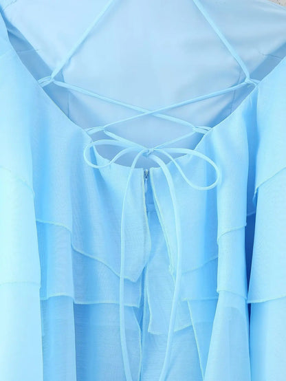 Close-up of the elegant layered decorative dress in light blue with lace-up back detail