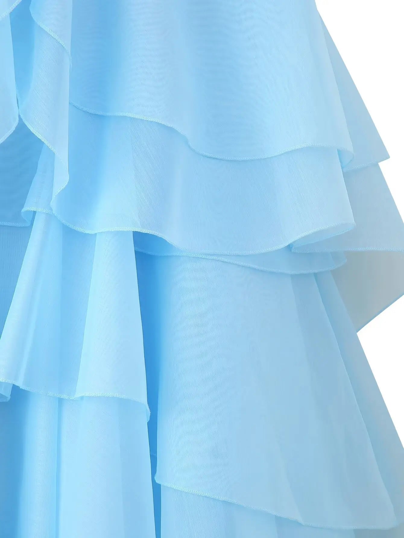 EtherealBe elegant layered decorative dress in soft blue with delicate ruffles for a graceful look