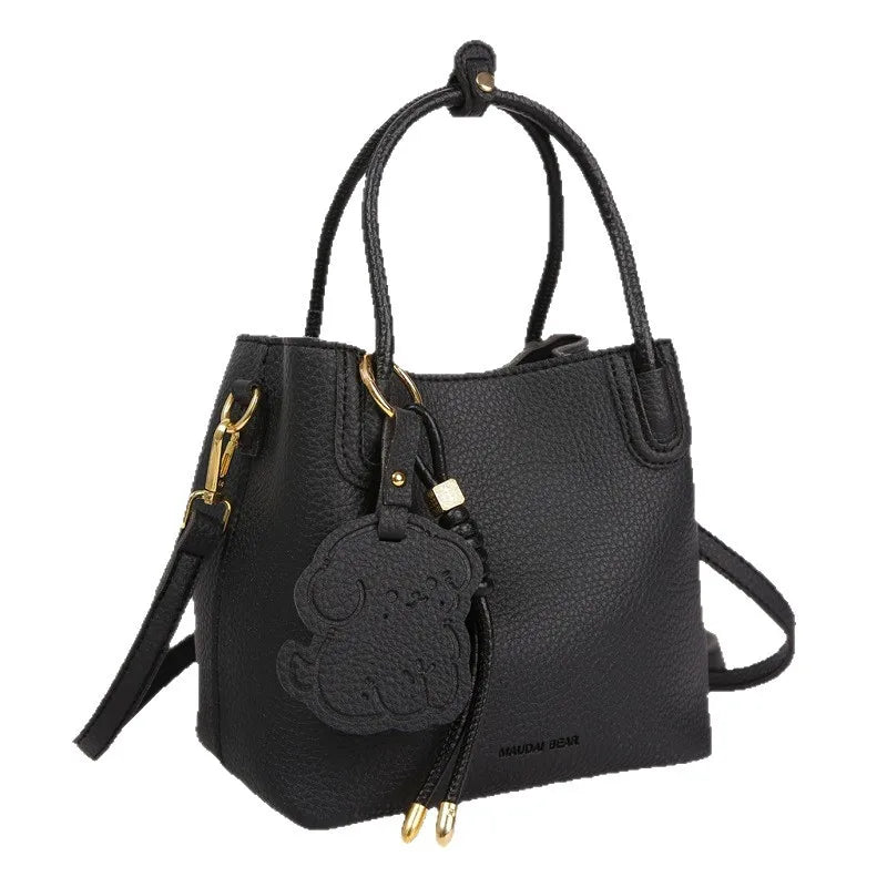 EtherealBe stylish black bag with gold accents, perfect as a fashionable work bag for women