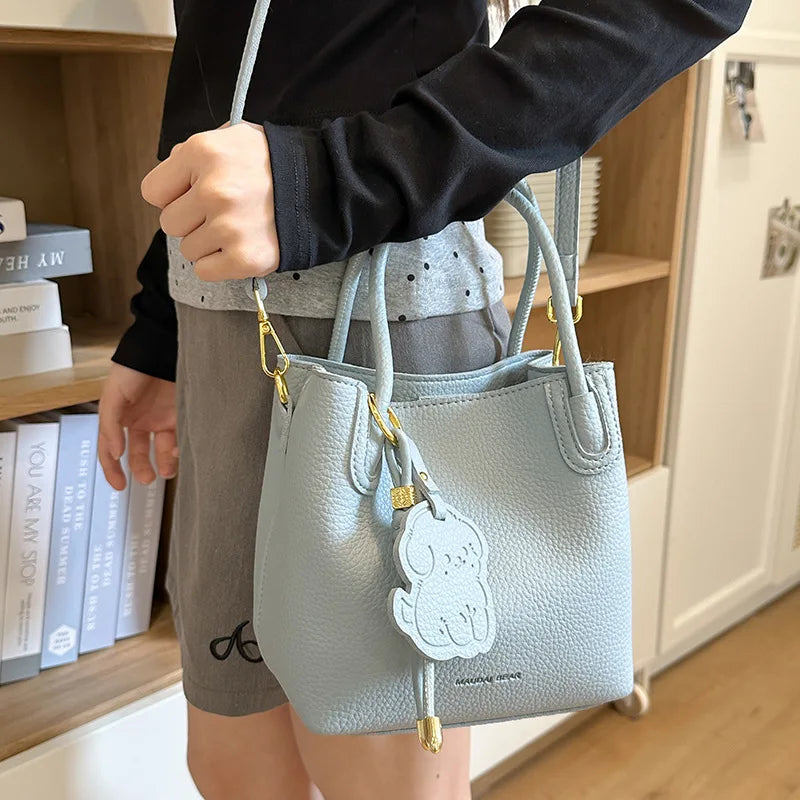 Light blue EtherealBe handbag with cute charm, perfect for fashionable work bags for women