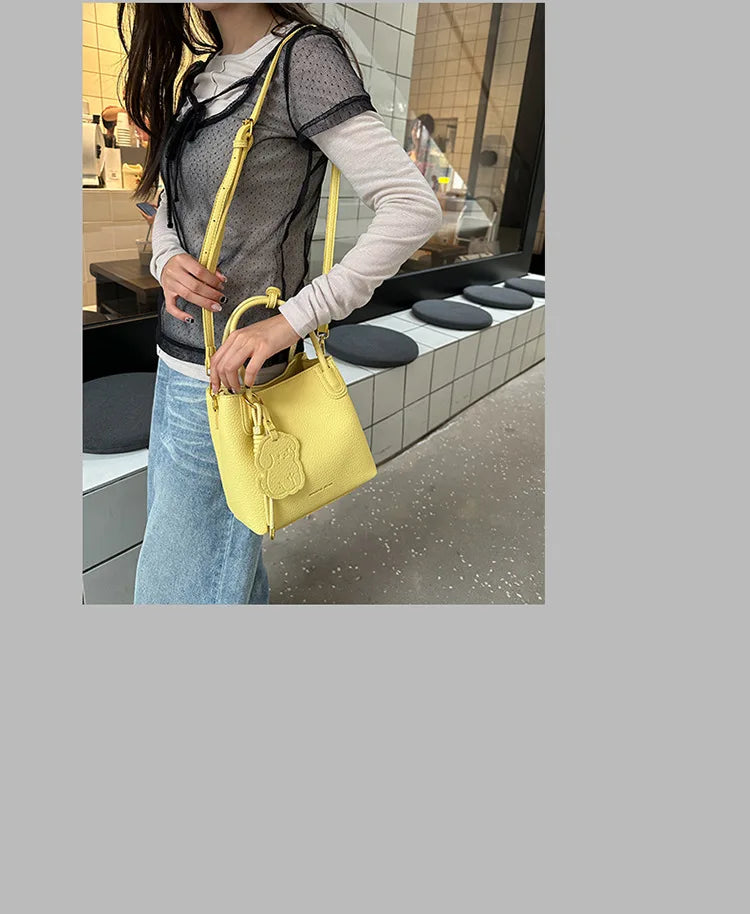 Stylish yellow handbag with crossbody strap, perfect fashionable work bags for women