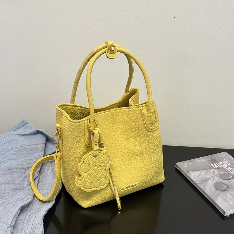 EtherealBe Yellow Handbag with Cute Charm, a stylish choice among fashionable work bags for women