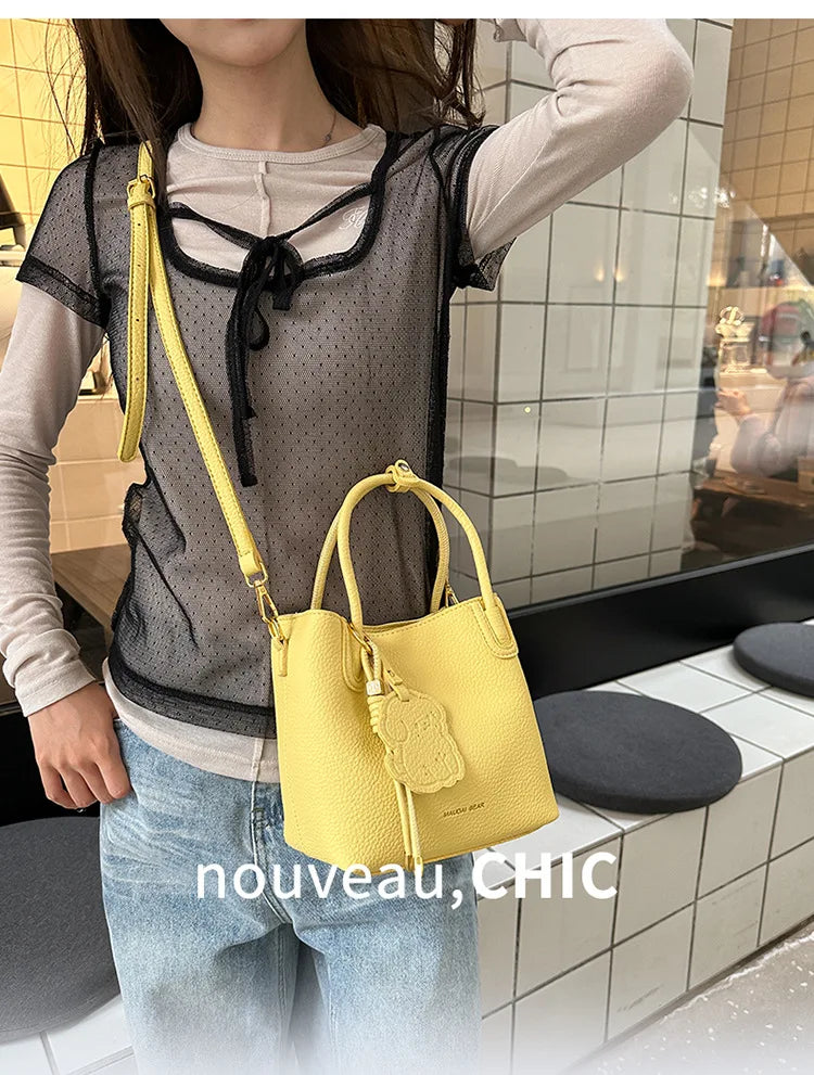 EtherealBe trendy yellow bucket bag ideal for stylish professionals, perfect fashionable work bags for women