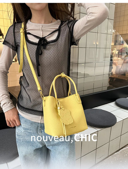 EtherealBe trendy yellow bucket bag ideal for stylish professionals, perfect fashionable work bags for women