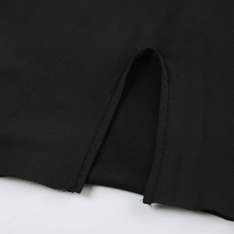 Close up of side slit hem and stitching detail on EtherealBe black long sleeve mini dress fabric