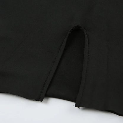 Close up of side slit hem and stitching detail on EtherealBe black long sleeve mini dress fabric
