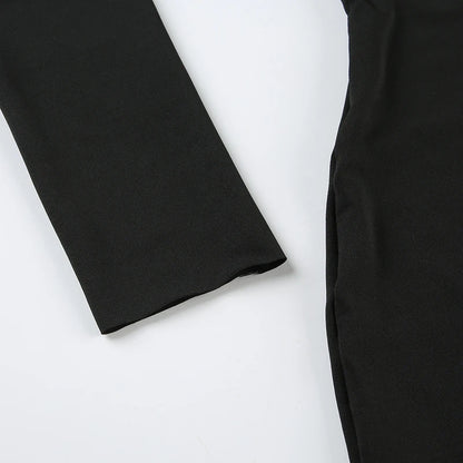 Close up of black long sleeve mini dress showing fitted side seam and smooth stretch fabric on white background