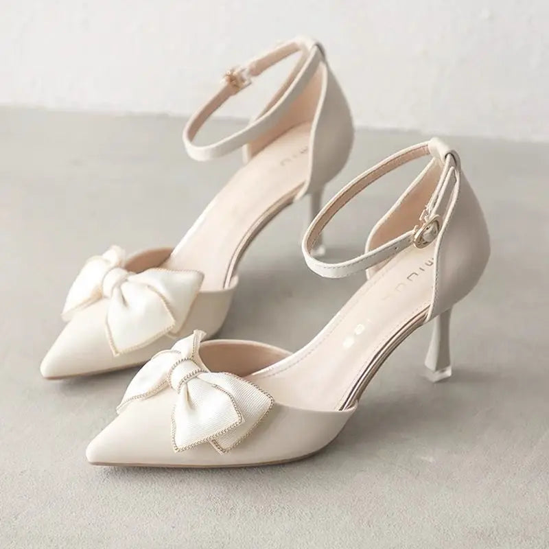 Elegant white butterfly stiletto heels with bow detail and ankle strap for stylish occasions
