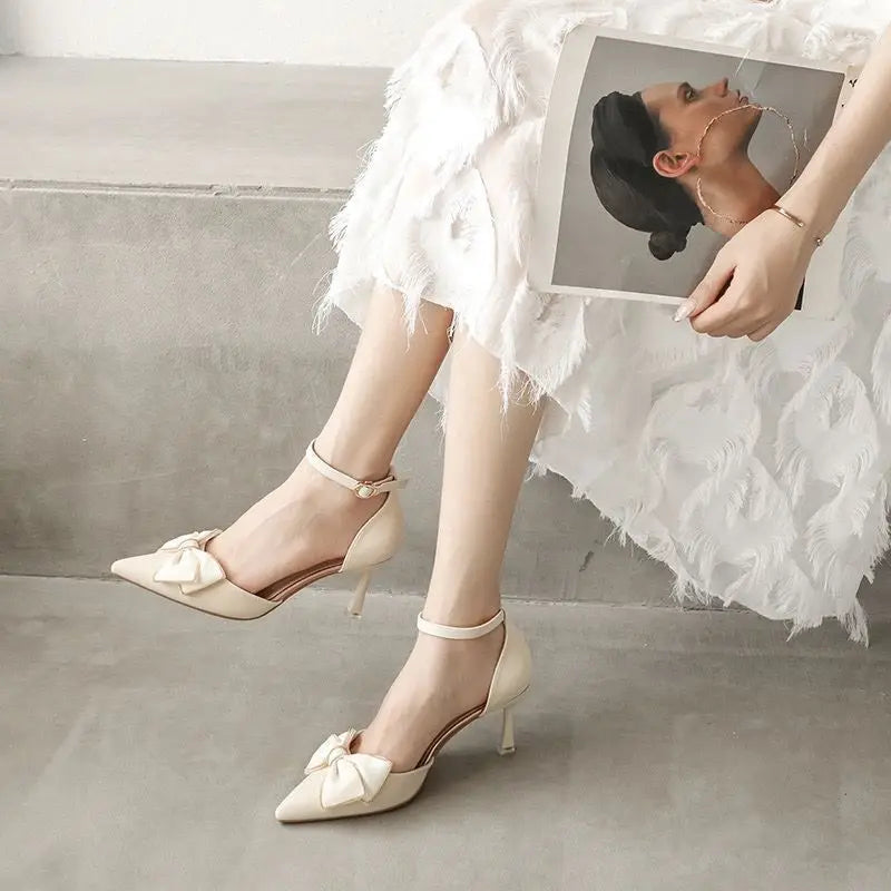 EtherealBe white butterfly stiletto heels with ankle strap and bow detail, perfect for elegant occasions