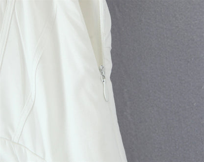 Close-up of white lace panel midi dress for women showcasing zipper detail and elegant design