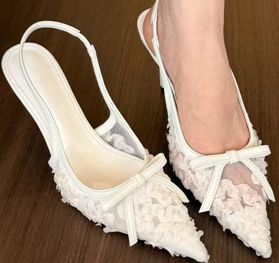 Elegant white lace slingback heels women with floral details and a stylish bow for chic occasions