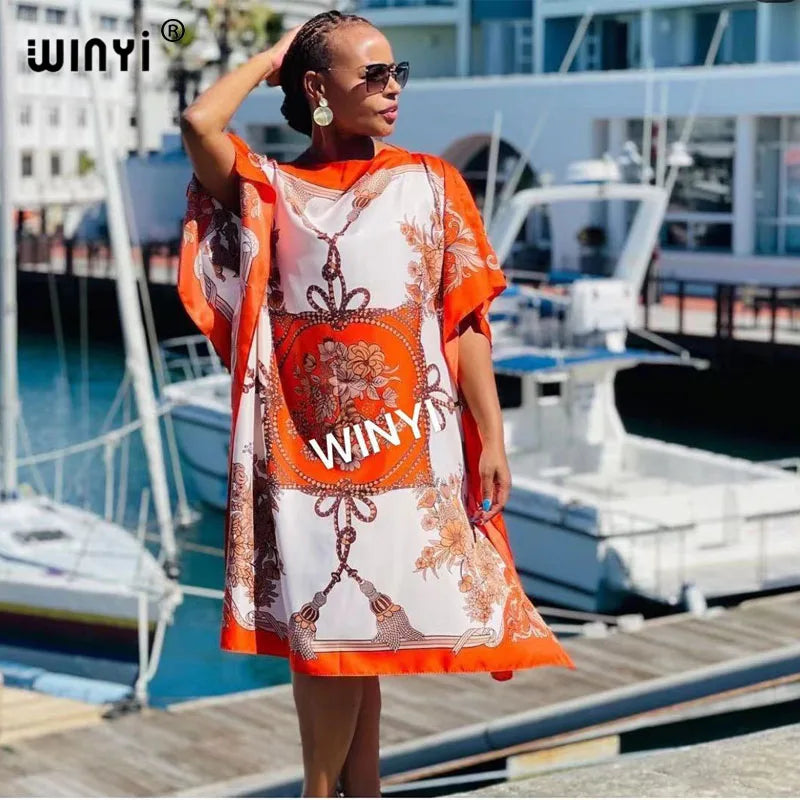 Stylish long femme chic vestido for women in vibrant orange, perfect for summer outings