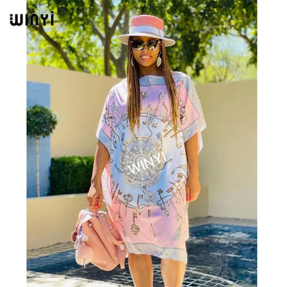 Chic long femme chic vestido for women in pastel colors with stylish accessories and a summer hat