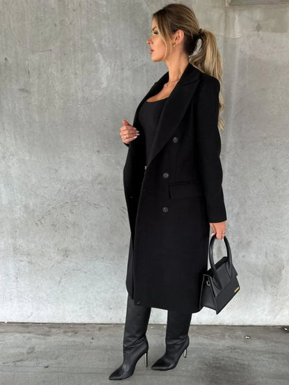 Stylish women's double-breasted wool coat in black, paired with knee-high boots and a chic handbag