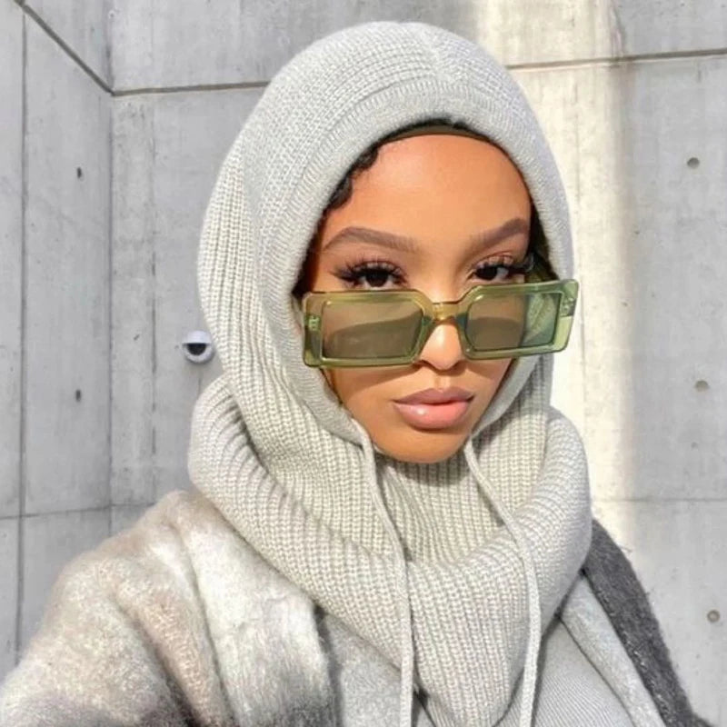 Stylish knit pullover balaclava for women in light gray, perfect for modern winter fashion.