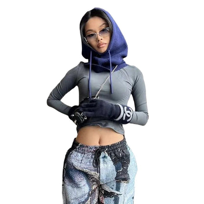 Stylish woman wearing a knit pullover balaclava for women, paired with a fitted top and pants