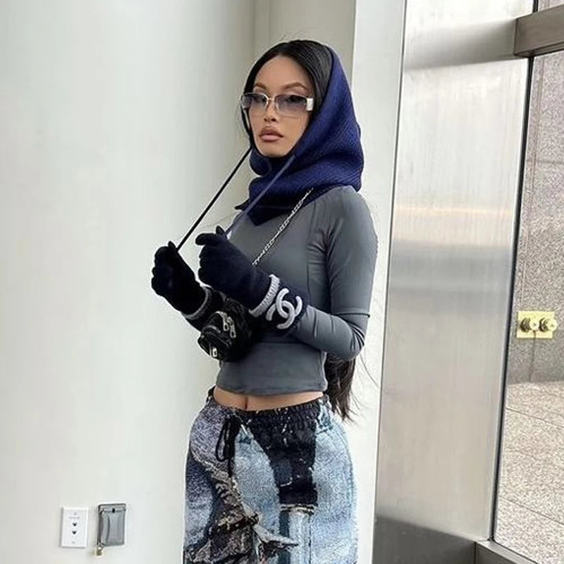 Stylish knit pullover balaclava for women paired with modern gloves and fitted top