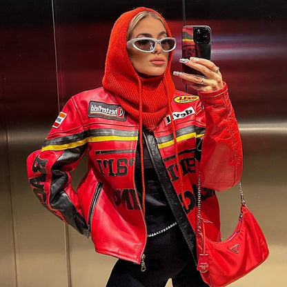 Stylish model wearing a red knit pullover balaclava for women with a bold leather jacket