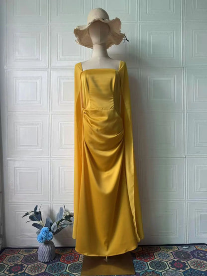 Ethereal women's fairy style formal gown in yellow with flowing fabric and elegant design