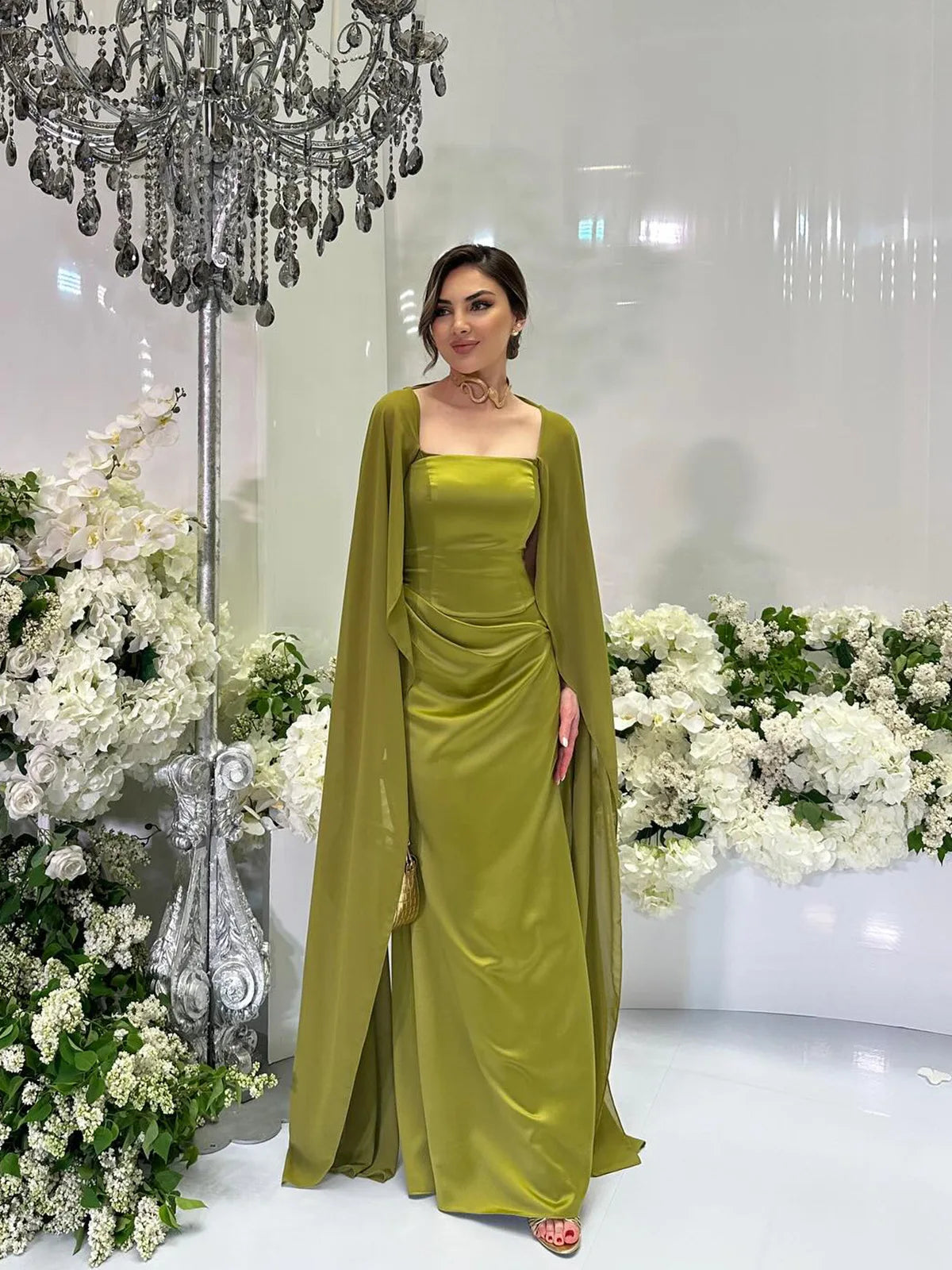 Elegant women's fairy style formal gown in olive green with a flowing cape for special occasions