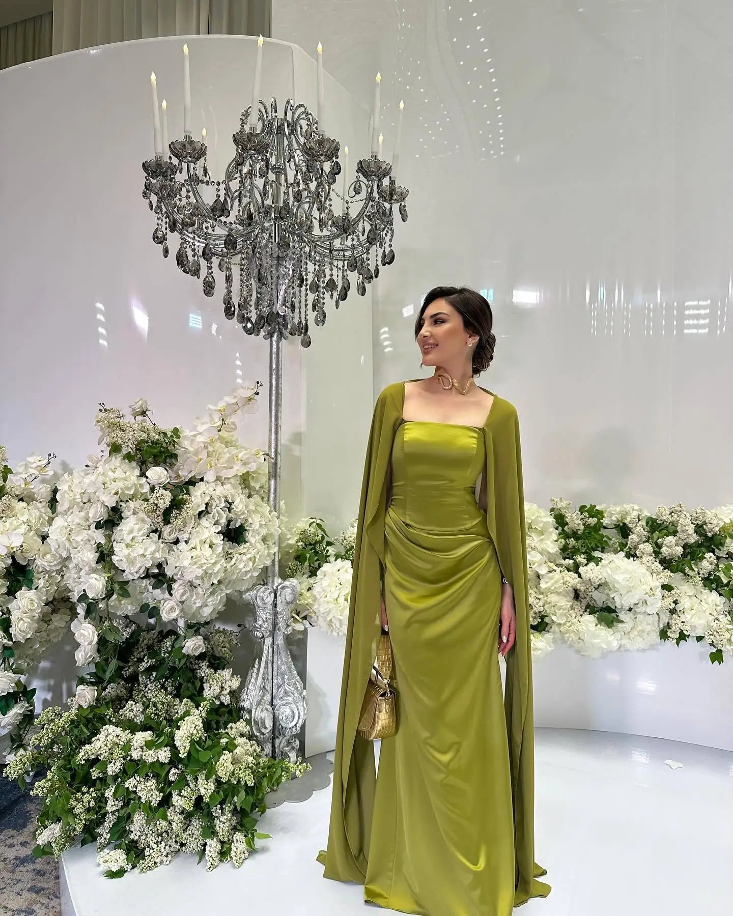 Elegant women's fairy style formal gown in green with flowing cape perfect for special events