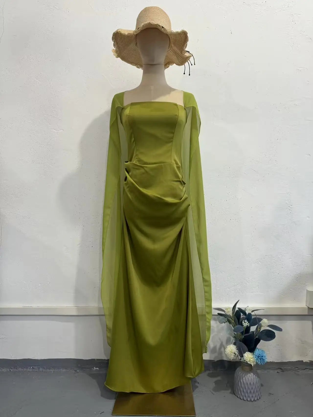 Ethereal women's fairy style formal gown in green with flowing sleeves for elegant occasions