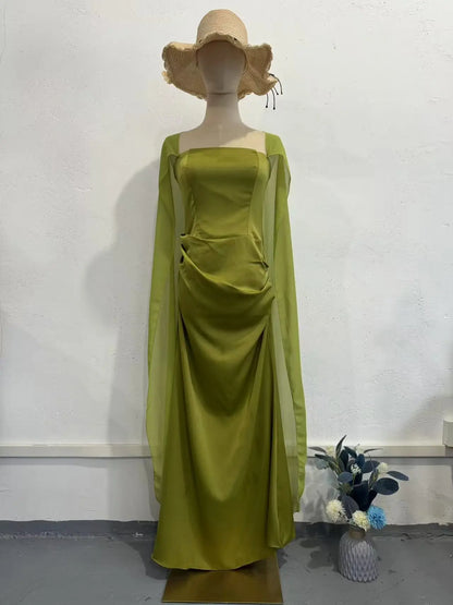 Ethereal women's fairy style formal gown in green with flowing sleeves for elegant occasions