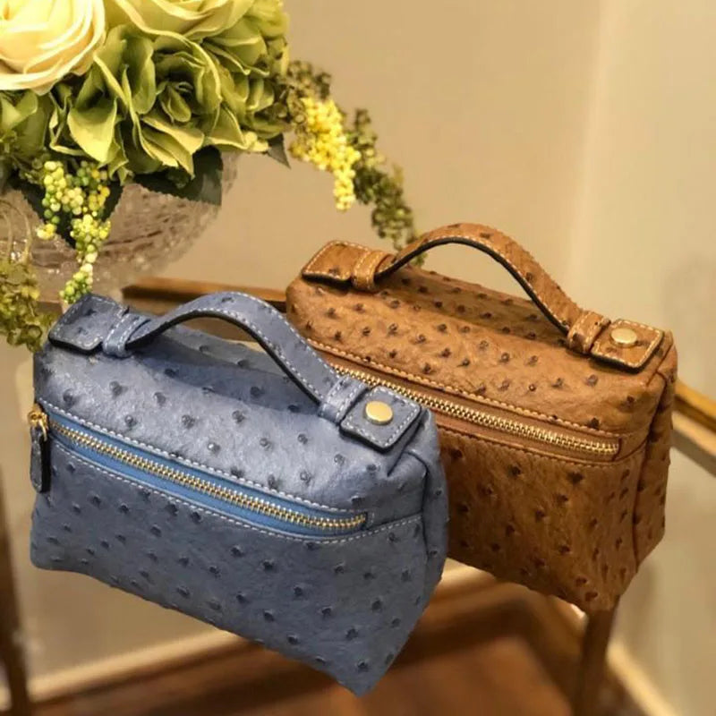 EtherealBe luxurious faux crocodile makeup bag in blue and brown with a stylish design and functional handle