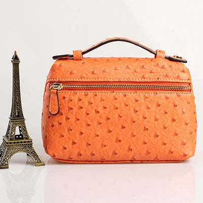 EtherealBe luxurious faux crocodile makeup bag in vibrant orange with zippered compartments