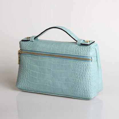 EtherealBe luxurious faux crocodile makeup bag in light blue with a secure zipper and stylish handle