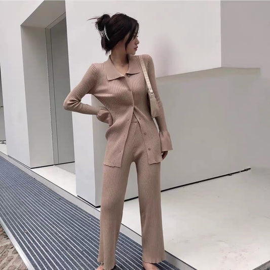 Woman in beige ribbed collared cardigan and wide leg pants outfit with shoulder bag trendy lounge sets for women