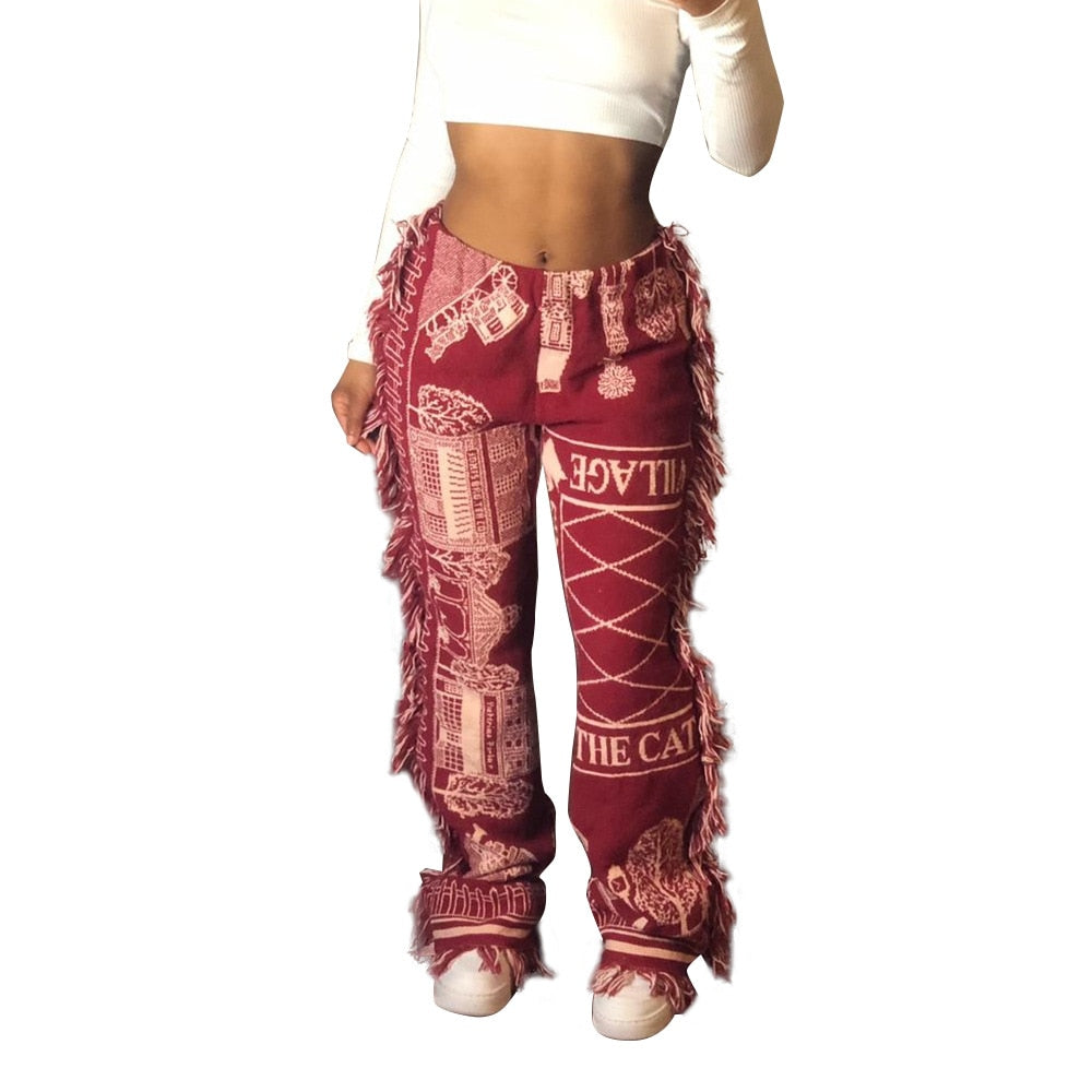 EtherealBe tassel patchwork striped pants in burgundy with fringe side seams and vintage cream prints on model
