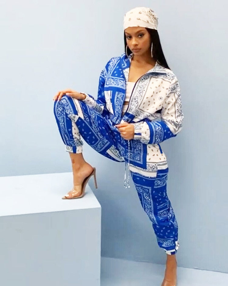 Model wearing blue and white paisley bandana print tracksuit women with matching headscarf and heels