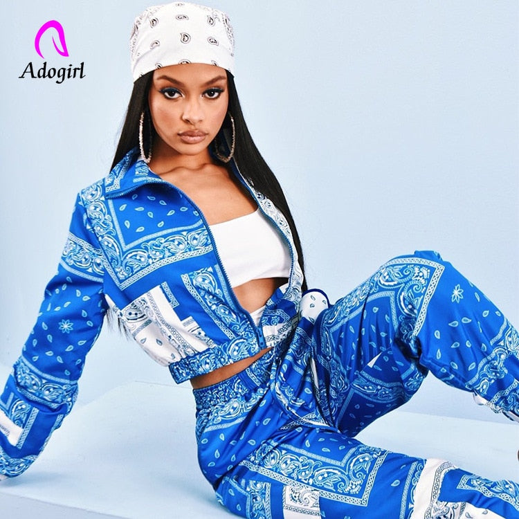 Model wearing blue paisley bandana print tracksuit women crop zip jacket and matching joggers with white bandana
