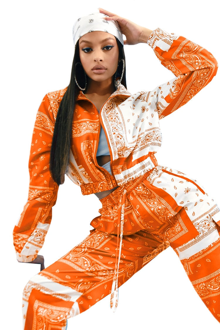 Orange and white paisley bandana print tracksuit women with cropped zip jacket drawstring pants and matching headscarf