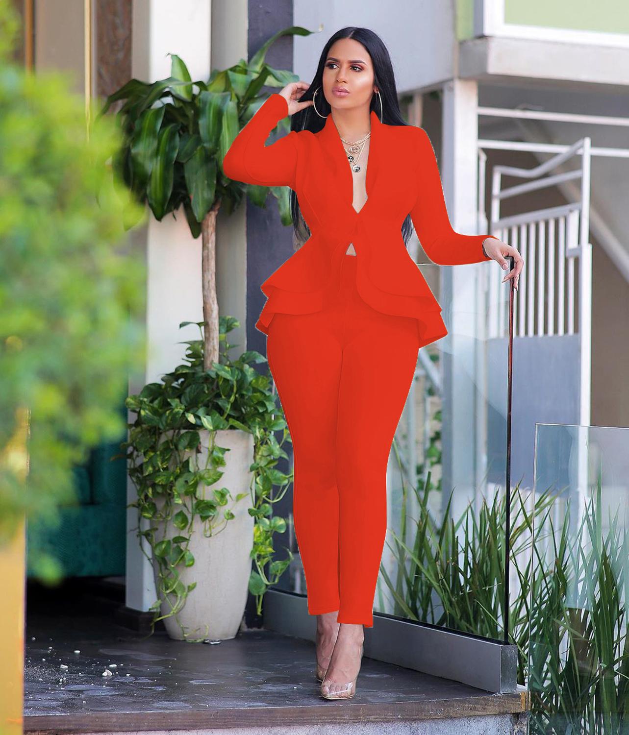 Model in bright red women ruffle blazer pants set with peplum ruffles and slim ankle pants