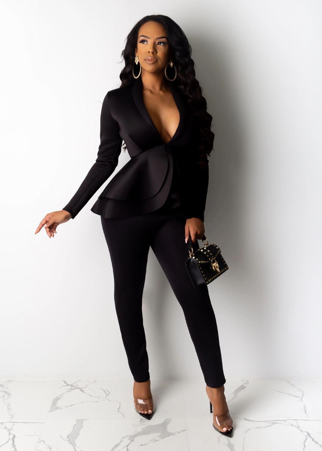 Black women ruffle blazer pants set on model with peplum ruffle blazer slim tailored pants and studded handbag