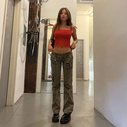 Model wearing EtherealBe grunge streetwear straight leg pants in olive cargo style with red crop top