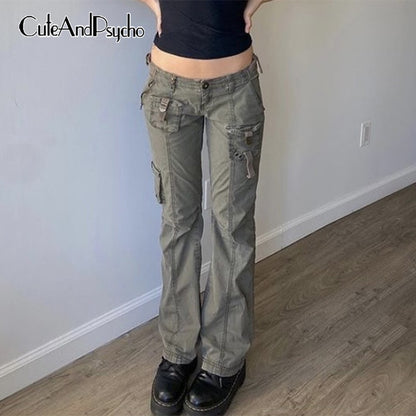 Olive cargo pants worn with black crop top and platform boots grunge streetwear straight leg pants for edgy casual style