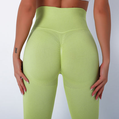 Light green high waist seamless push up gym leggings on model back view with scrunch seam and contouring
